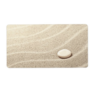 Étiquette Arrière - plan de sable avec la pierre blanche