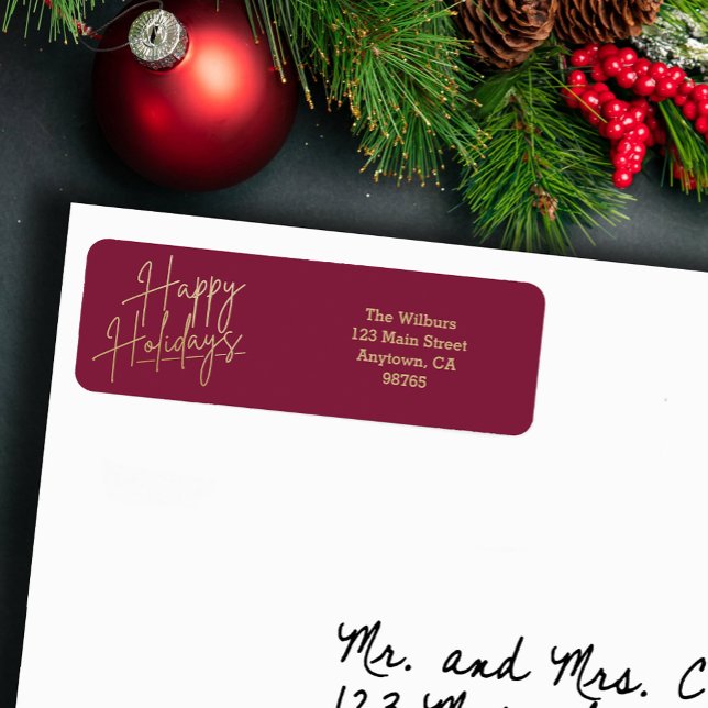 Étiquette Gold Happy Holidays Cranberry Return Address (Gold script Happy Holidays on small cranberry horizontal return address labels)