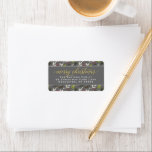 Étiquette Merry Christmas Gray Gold Elegant Script Address<br><div class="desc">"Merry Christmas" holiday return address labels feature a watercolor floral pattern of holiday greenery leaves and berries design with modern elegant gold script greeting text and classic return address text that can be personalized with your family name and home address. Includes a dark charcoal gray background color.</div>