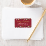 Étiquette Merry Christmas Red Gold Elegant Script Address<br><div class="desc">"Merry Christmas" holiday return address labels feature a watercolor floral pattern of holiday greenery leaves and berries design with modern elegant gold script greeting text and classic return address text that can be personalized with your family name and home address. Includes a classic rich red background color.</div>