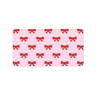 Étiquette Motif de Bow en ruban rouge sur Pink.