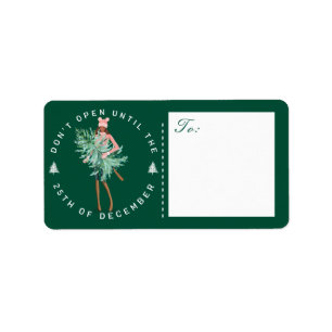 Étiquette Ne pas ouvrir avant Noël Fille tenant un arbre