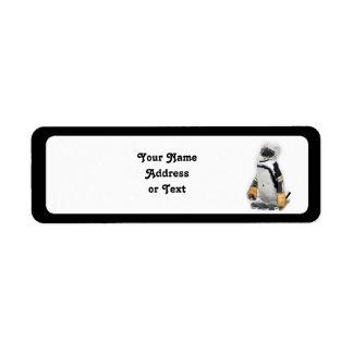 Étiquette Petit Penguin portant un engin de hockey