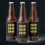 Étiquette Pour Bouteilles De Bière Ho Ho Ho | Simple Christmas Black & Gold Beer Bot<br><div class="desc">Étiquette simple bouteille de bière noir & or de Noël avec texte "Ho Ho Ho" dans un style amusant mais élégant typographie. Customisez avec un bref message d'accueil et le nom de l'expéditeur. Mélanger et correspondre avec d'autres modèles de cette série.</div>