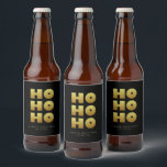 Étiquette Pour Bouteilles De Bière Ho Ho Ho | Simple Christmas Black & Gold Beer Bot<br><div class="desc">Étiquette simple bouteille de bière noir & or de Noël avec texte "Ho Ho Ho" dans un style amusant mais élégant typographie. Customisez avec un bref message d'accueil et le nom de l'expéditeur. Mélanger et correspondre avec d'autres modèles de cette série.</div>