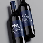 Étiquette Pour Bouteilles De Vin Navy and White Brush Script Merry Christmas<br><div class="desc">Festive holiday wine labels featuring "Merry Christmas" displayed in white brush script lettering with a navy background. Personalize the Merry Christmas wine labels with your family name and the year displayed in white lettering.</div>