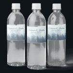 Étiquette Pour Bouteilles D'eau Misty Blue Mountains & Pine Forest Rustic Mariage<br><div class="desc">Ces étiquettes de bouteilles d'eau rendront votre célébration mariage d'autant plus spéciale. Elles présentent un design rustique mais élégant avec un paysage de pics bleus bruns recouvert de pins ou d'épinettes. Il y a des lettres de script pour les noms du couple mariage et un endroit pour entrer la date...</div>