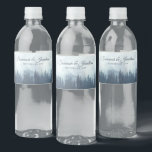 Étiquette Pour Bouteilles D'eau Misty Blue Mountains & Pine Forest Rustic Mariage<br><div class="desc">Ces étiquettes de bouteilles d'eau rendront votre célébration mariage d'autant plus spéciale. Elles présentent un design rustique mais élégant avec un paysage de pics bleus bruns recouvert de pins ou d'épinettes. Il y a des lettres de script pour les noms du couple mariage et un endroit pour entrer la date...</div>