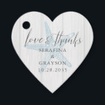 Étiquettes Cadeau Amour et Merci Rustic Beach Starfish Forme de coeu<br><div class="desc">Heart Shape Favor Tag pour un mariage rustique à la plage avec une illustration vintage d'étoiles de mer et une police de serif classique et élégante calligraphie écriture manuscrite "amour et merci" avec des noms et date mariage. Utilisez l'outil de conception pour modifier les couleurs ou les polices afin de...</div>