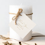 Étiquettes Cadeau Calligraphie Or Délicate | Merci de crème<br><div class="desc">Cette délicate crème de calligraphie or merci les étiquettes de faveur sont parfaites pour un mariage moderne. Le design minimaliste romantique présente une belle et élégante typographie de champagne jaune doré sur un arrière - plan de crème d'ivoire au look épuré et sobre. Customisez ces étiquettes avec vos noms et...</div>