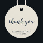 Étiquettes Cadeau Merci Simple Uni Couleur Ivoire Mariage<br><div class="desc">Étiquettes de remerciement de mariage de couleur unie de base avec un design minimal avec le message "merci" dans une élégante police de caractères script bleu marine, et votre nom et date dans une police serif, sur un fond ivoire. Les polices et les couleurs de fond peuvent être modifiées selon...</div>