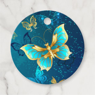 Étiquettes Cadeau Papillons d'or sur un Arrière - plan bleu