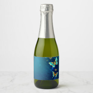 Étiquettes Pour Bouteilles De Vin Mousseux Papillons d'or sur un Arrière - plan bleu