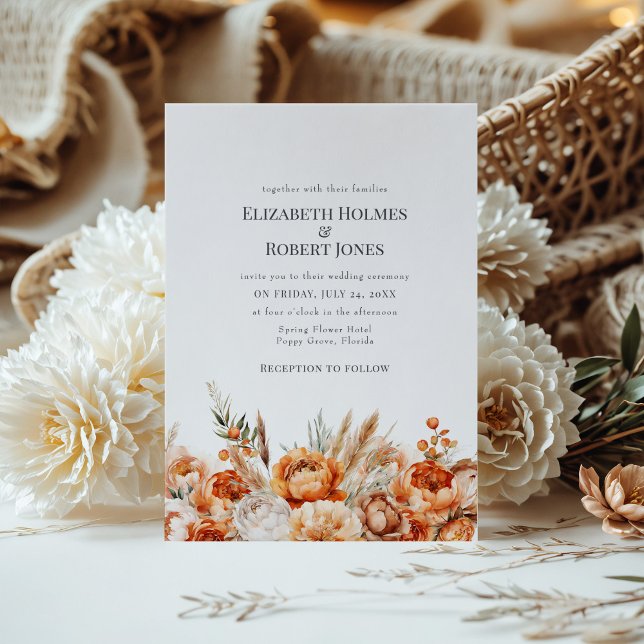 Faire-part de mariage aux fleurs séchées corail et (Boho Coral and Peach Dry Flowers Wedding Invite on a table with a boho flower bouquet.)