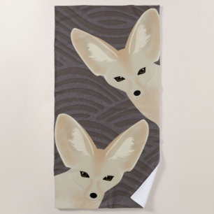 Fennec macule la serviette de plage
