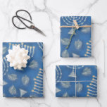 Feuille De Papier Cadeau Chanukah Chanukah<br><div class="desc">Ensemble de trois feuilles de papier d'emballage semi-brillant de 19 po x 29 po avec une image de dreidels en argent et des menorahs en argent éclairés sur le bleu. Voir les confettis correspondants, autocollant étiquette et carré. Consultez la collection de papier d'emballage Hanoukka dans la catégorie HOME de la...</div>