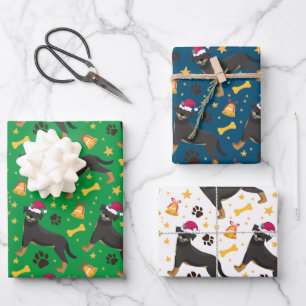 Feuille De Papier Cadeau Chien Rottweiler avec le chapeau du Père Noël