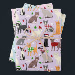 Feuille De Papier Cadeau Christmas Cats Pastel<br><div class="desc">Chat blanc mignon,  chat noir,  chat tabby,  chat persan,  chat siamois et chat tuxedo habillés de tenues de vacances festives,  chapeaux de Père Noël et chandails Jacquards avec motif pastel parsemé d'ornements de Noël.</div>