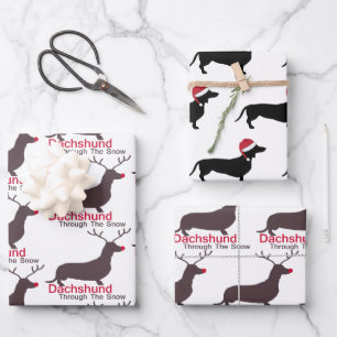 Feuille De Papier Cadeau Dachshund De Noël À Travers La Neige