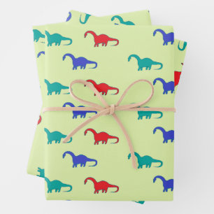Feuille De Papier Cadeau Dinosaures colorés motif sur vert