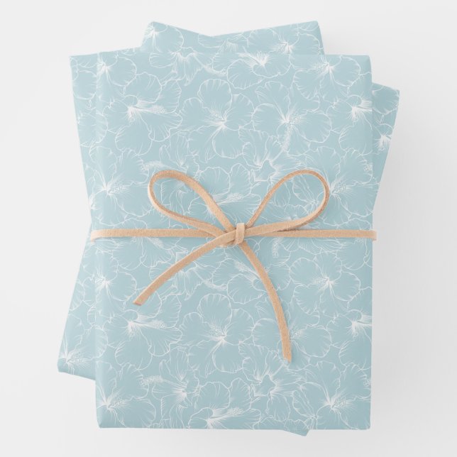Feuille De Papier Cadeau Fleurs blanches sur fond bleu (En situation)