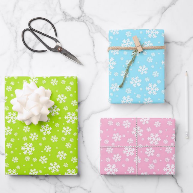 Feuille De Papier Cadeau Flocons blancs sur fond vert, bleu et rose (Recto)