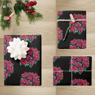 Feuille De Papier Cadeau Poinsettia rouge, fleur de Noël sur fond noir
