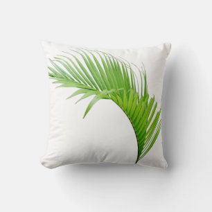 Feuille verte de palmier tropical sur un coussin j