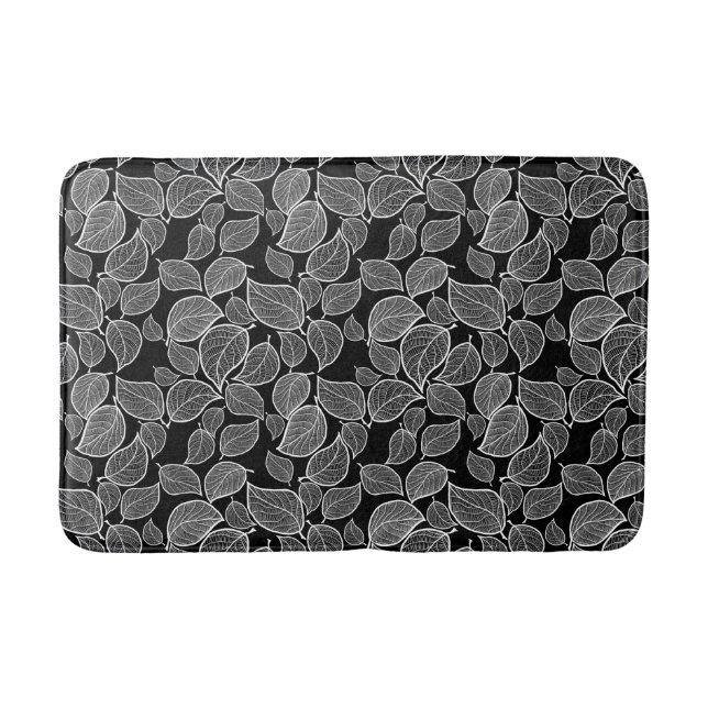 Feuilles blanches sur tapis de bain noir (Devant)