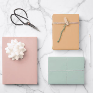 Feuilles de papier cadeau rose pastel orange vert