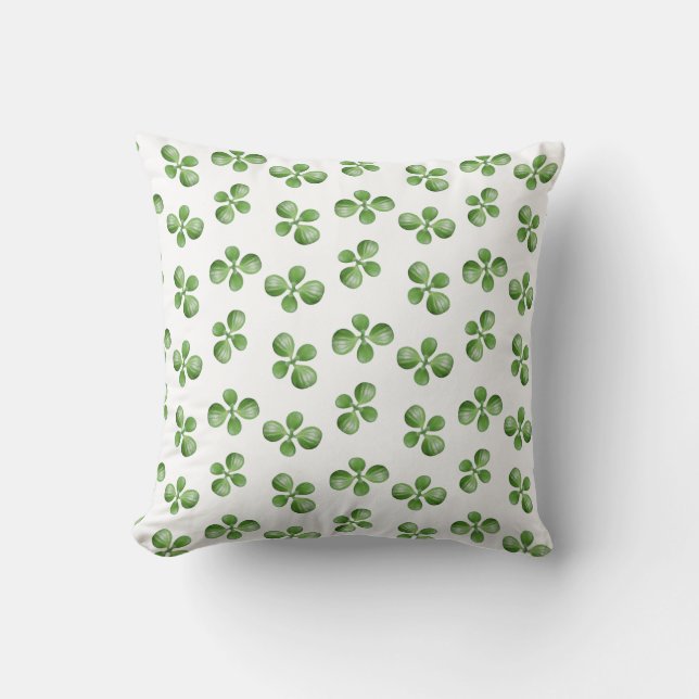 Feuilles de succulente vertes sur un coussin blanc (Recto)