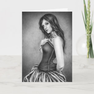 Fille avec la carte de voeux rose