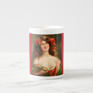 Fille avec la tasse de porcelaine tendre de