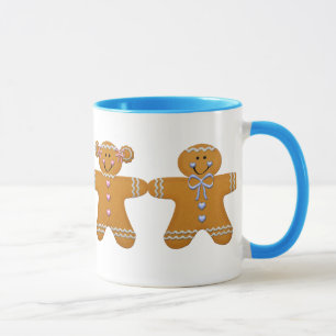 Fille de pain d'épice et tasse de garçon