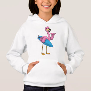 Flamant rose comme Surfer avec Surfboard