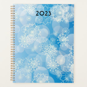 Flammes de neige de Noël sur un arrière - plan ble