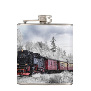 Flasques Train vintage traversant le paysage hivernal