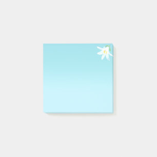 Fleur d'Amaryllis blanche sur des notes Post-it bl