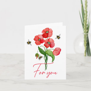 Fleur de coquelicot et bourdons