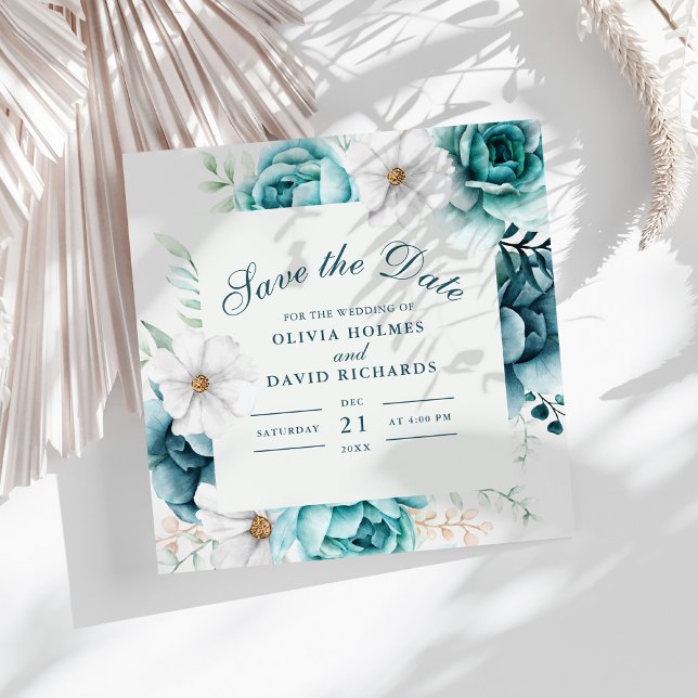 Fleur Sauvage Turquoise Save the Date | Floral Boh (Teal and Off-White Wildflowers Save The Date Card on a white boho table with dry palm leaf.)