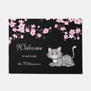 Fleurs de cerisiers et tapis de bienvenue noir ros