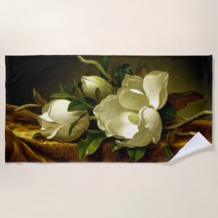 Fleurs de Magnolia Heade sur la serviette de plage