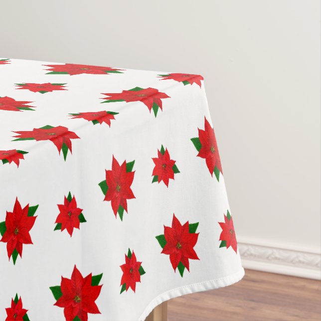 Fleurs de Poinsettia de Noël sur nappe blanche (In Situ)