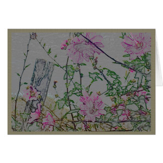 Fleurs roses sur une barrière