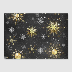 Flocons de Noël dorés sur fond noir