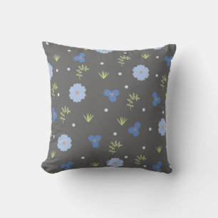 Flore bleu mignonne sur oreiller gris