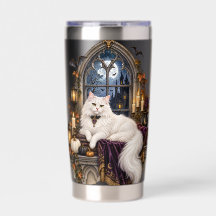 CHAT BLANC SUR LE THÈME D'HALLOWEEN DANS LA FENÊTR
