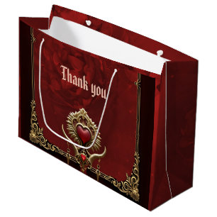 Grand Sac Cadeau Élégance en lustre rouge avec un coeur orné.