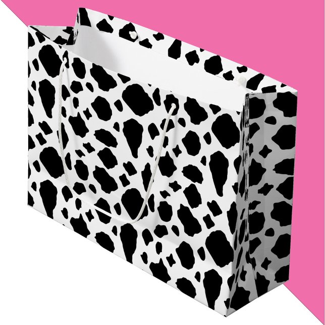 Grand Sac Cadeau Impression vache noir et blanc (A gift bag with a black and white cow pattern.)