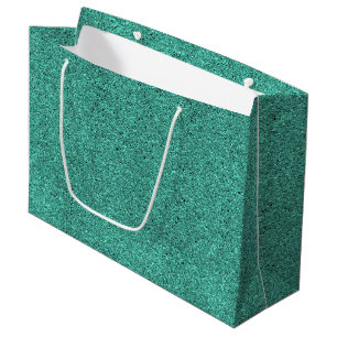 Grand Sac Cadeau Un sac-cadeau vert avec une poignée blanche